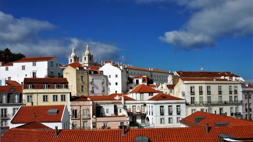 View of buildings in city against sky