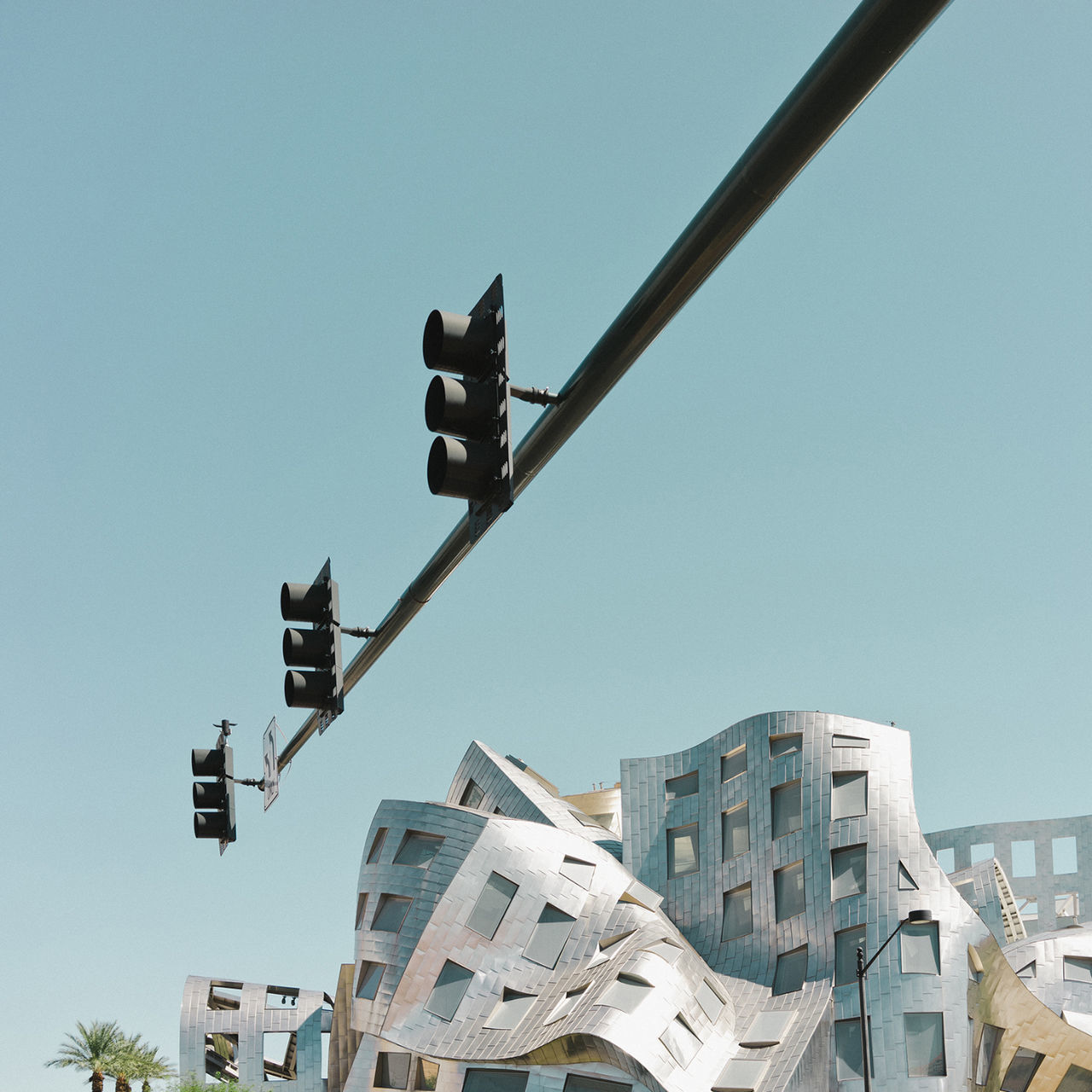 building exterior, architecture, clear sky, low angle view, skyscraper, city, sky, built structure, outdoors, no people, day, modern, cityscape