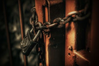 Close-up of padlock on metal gate