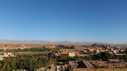 High angle view of townscape against clear blue sky