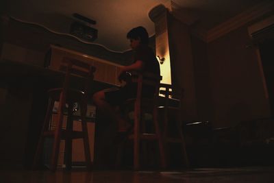 Young man standing at home