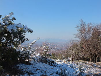 Scenic view of snow covered mountain against clear sky