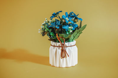 Close-up of flower vase against white background