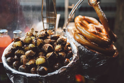 High angle view of pretzels and chestnuts for sale in shop