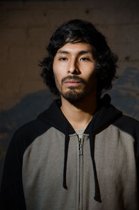 Portrait of young man standing outdoors