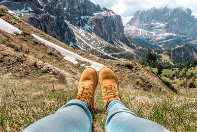 Low section of man standing on mountain