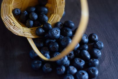 High angle view of fruits in basket on table
