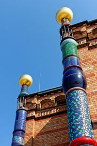 Low angle view of tower against blue sky