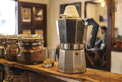 Close-up of coffee maker on table at home