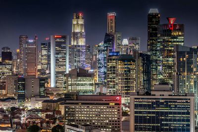 View of skyscrapers lit up at night