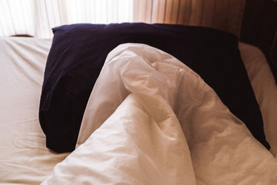 Close-up of blanket on bed at home