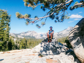 Woman standing on rocky mountain