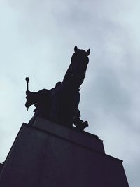 Low angle view of statue against sky