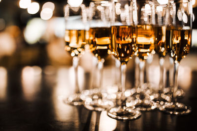 Close-up of wine glasses on table