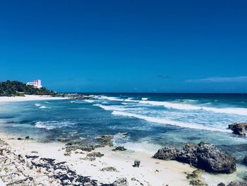 Scenic view of sea against clear blue sky