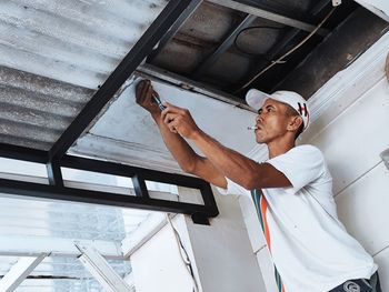 Low angle view of man looking at camera