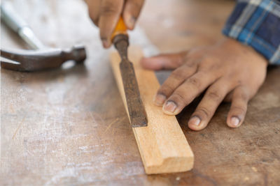 Midsection of man working in workshop