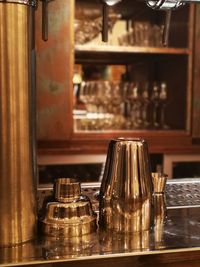 Close-up of cocktail shaker on counter at cafe