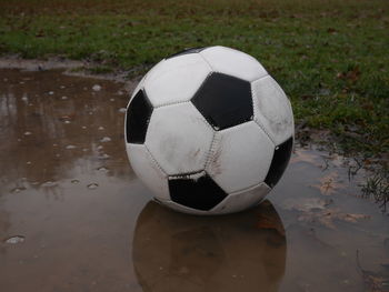 Close-up of soccer ball on footpath