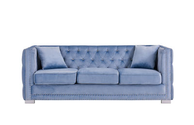 Close-up of sofa against white background