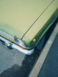 Close-up of vintage car on road