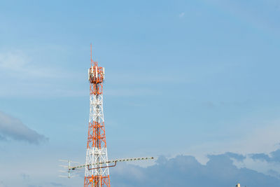 Low angle view of communications tower against sky