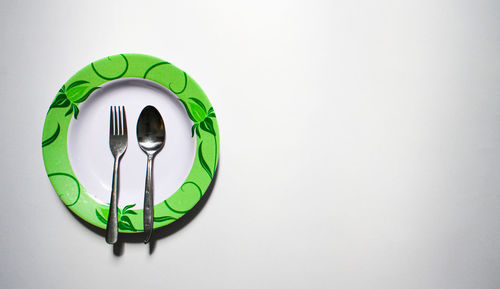 Close-up of clock over white background