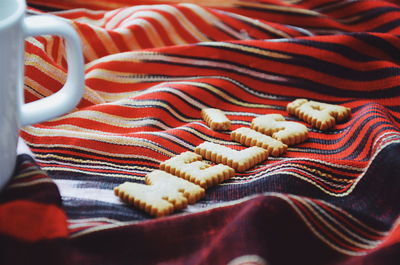 High angle view of cookies on fabric