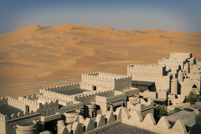 High angle view of city in desert against clear sky