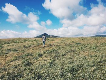 Full length of woman standing on field