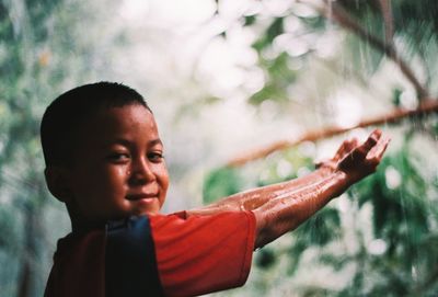 Portrait of boy looking away outdoors