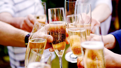 People cheering with champagne glasses 