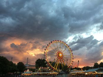 Ferris wheel against sky during sunset