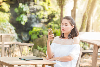 Young woman using smart phone