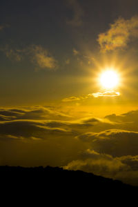 Low angle view of silhouette mountain against sky during sunset