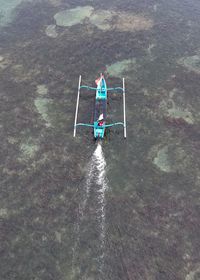 High angle view of man sitting in water