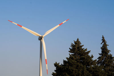 Low angle view of wind turbine against sky