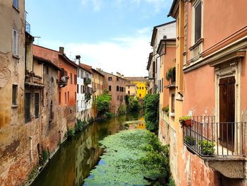 Canal amidst buildings in town