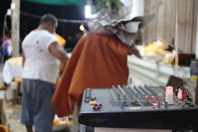 Rear view of people working on street