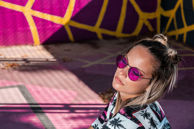 Portrait of young woman wearing sunglasses