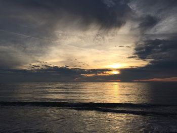 Scenic view of sea at sunset
