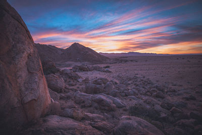 Scenic view of rocky mountains against sky during sunset