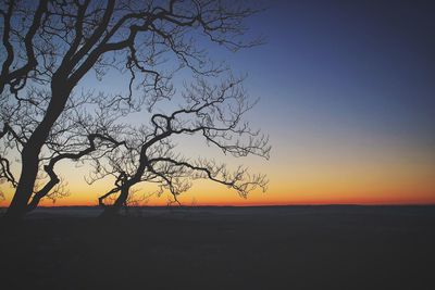 Scenic view of sea against clear sky during sunset