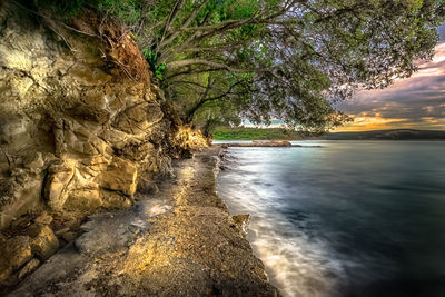 Scenic view of sea against sky at sunset