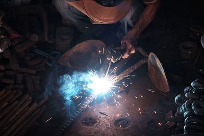 Man working on metal in factory