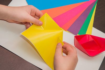 High angle view of person holding multi colored umbrella