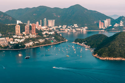 High angle view of sea and buildings in city