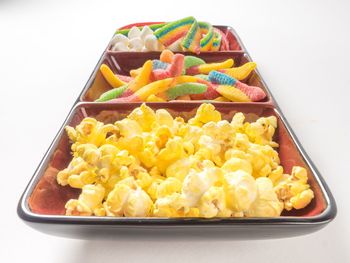 High angle view of multi colored candies in bowl