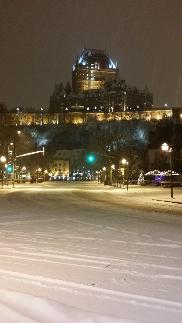 architecture, illuminated, night, building exterior, built structure, city, winter, snow, cold temperature, travel destinations, building, street, no people, nature, travel, light, outdoors, lighting, transportation, cityscape, sky, evening