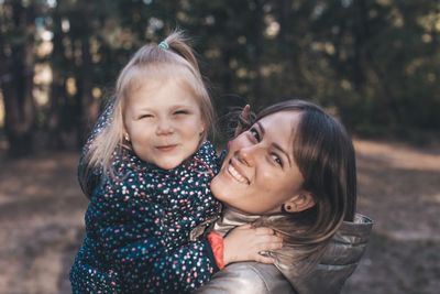 Portrait of a smiling girl and women 